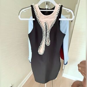 Elegant Black and Cream Dress with Pearl Detailing